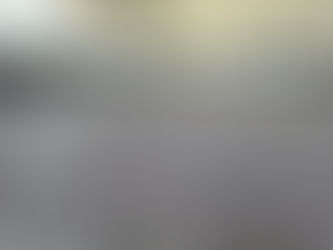 Modern finished garage with epoxy flooring and organized storage, showing how garage upgrades increase home value and functionality.