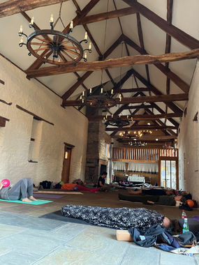 Group of people laying on yoga mats for relaxation exercise