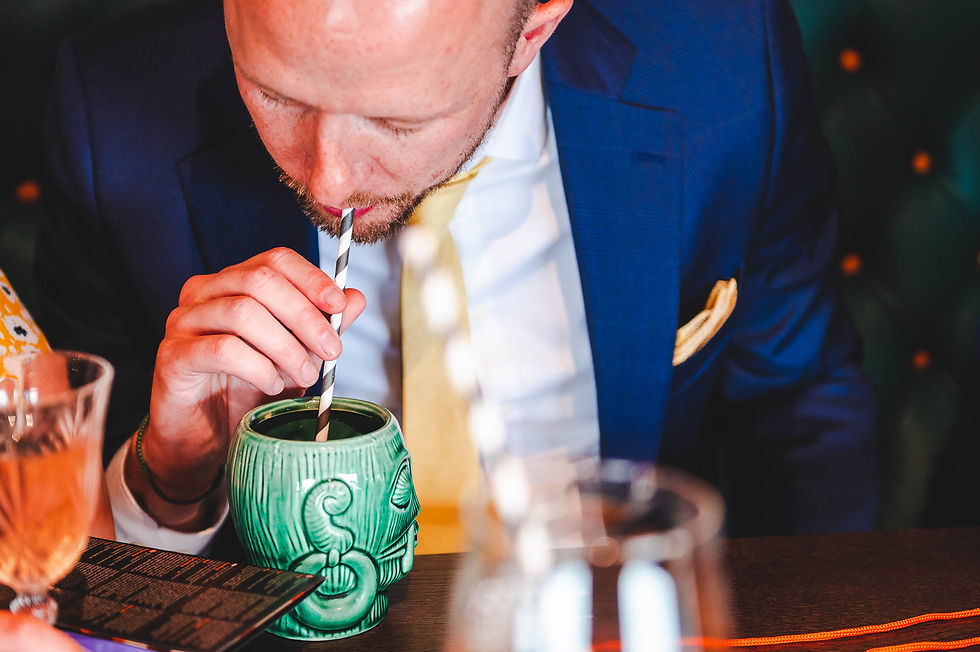 Man drinking from ceramic head - Wedding photography at The Station Kitchen, West Bay, Dorset
