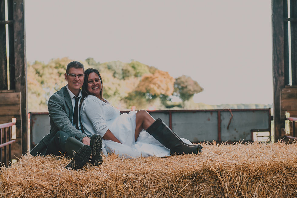 Couple on hay bale