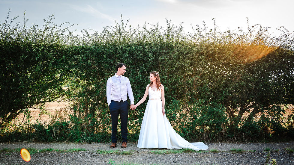 Couple during golden hour at a Wiltshire wedding venue, intimate couple portrait by wedding photographer Libby Clark Photography