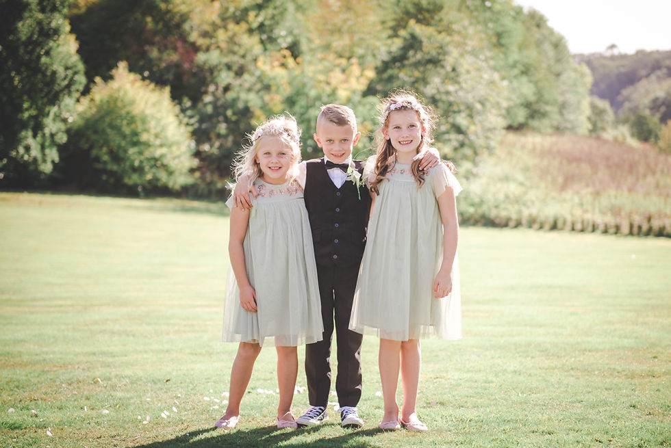 Page boy and flower girls in Tortworth Court grounds