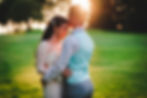 Newlyweds posing together in golden hour light during evening photos