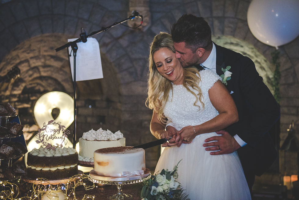 bride and groom cut the cake