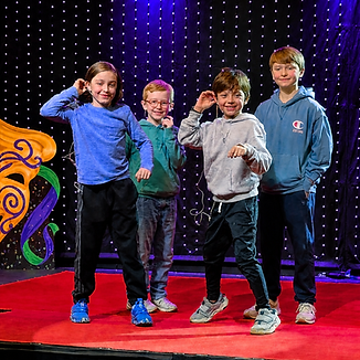 ACTING_class_with_boys_performing_on_stage.png