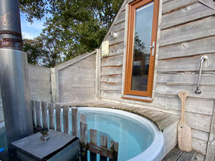 Glamping stay with hot tub Tinywood Homes for Family and Couples.