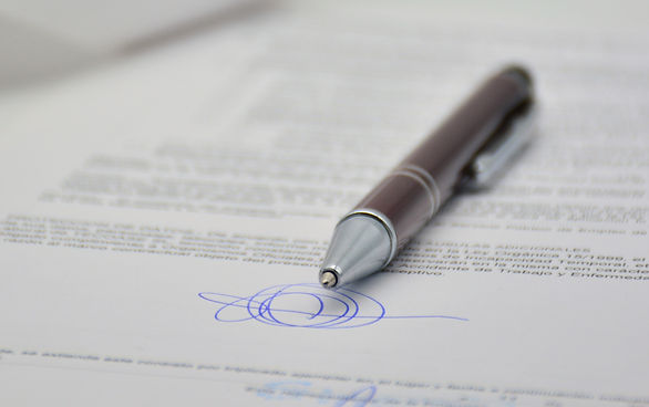 image of pen laying on signed document