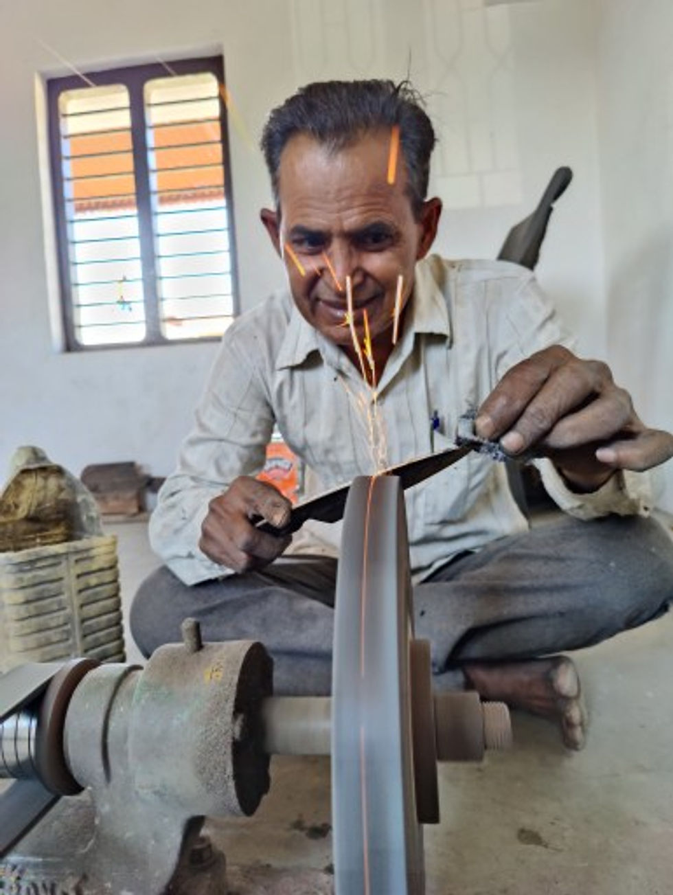 Narayan crafting a knife using time-honored techniques.