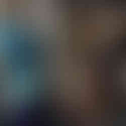 A man showing a stack of clothes