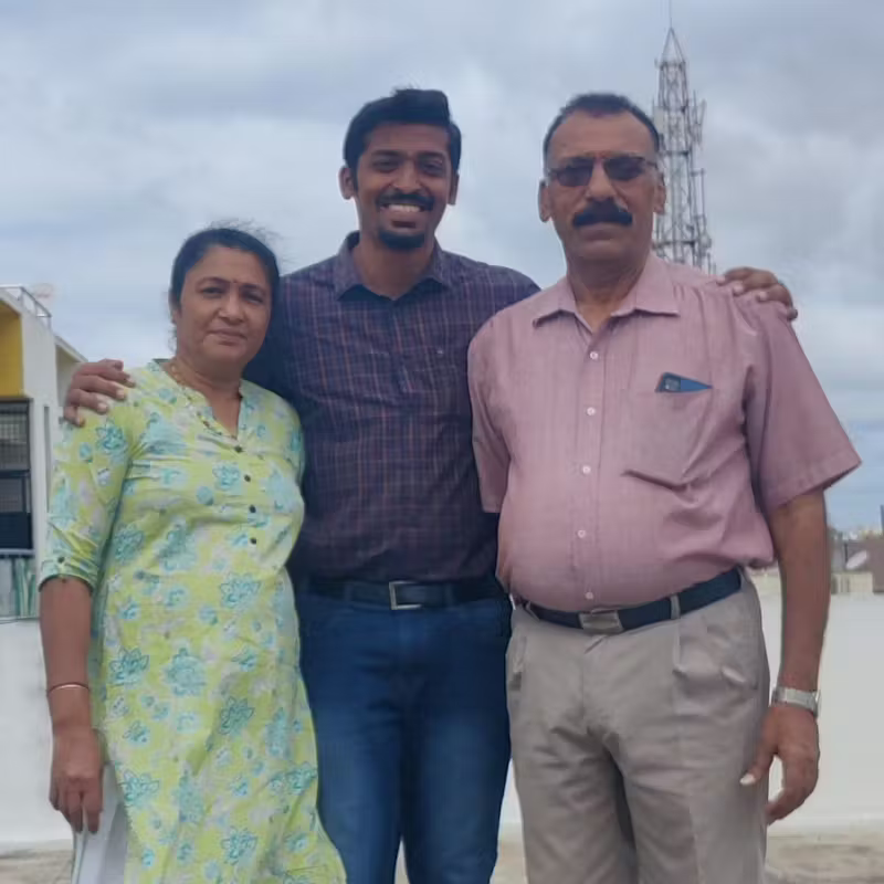 Sharan Subaiah standing with his parents
