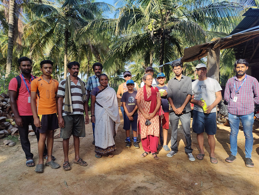 A group of rural entrepreneurs standing with Rang De team for a photograph.