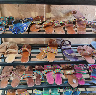 Handcrafted flip-flops fashioned by local artists using locally sourced materials.