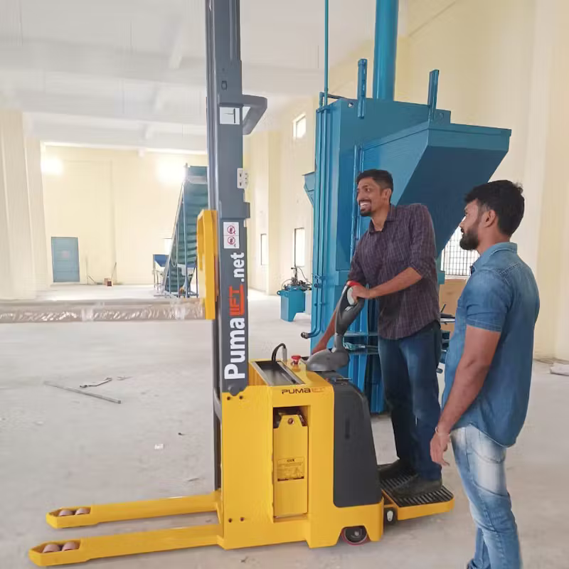Sharan Subaiah diligently operates a waste management machine.
