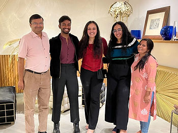 Jasmine standing with Rang De team members and Co-founder Ram.