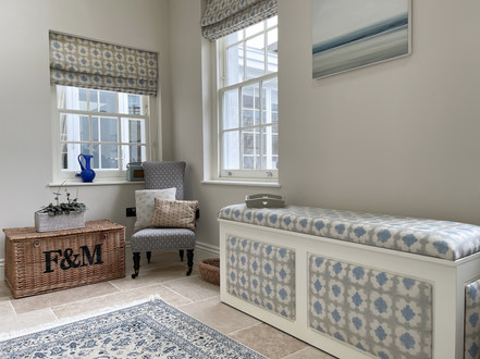 an ingeniously designed bank of cupboards hides a pop up bedroom
a drop down bed with lighting and side tables all made by London House Joinery