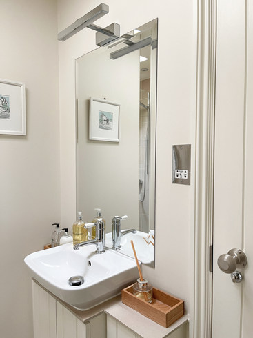 perfectly styled, the downstairs cloakroom comes complete with shower