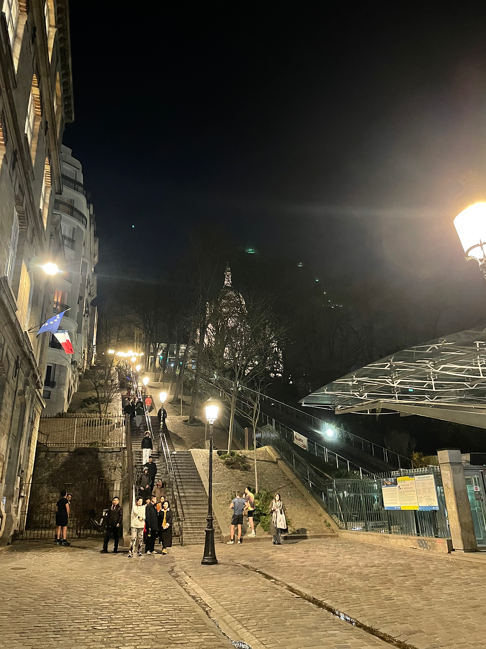 The steep 222 steps of Rue Foyatier in Montmartre, Paris, famously featured in John Wick 4, viewed from the bottom near the funicular.