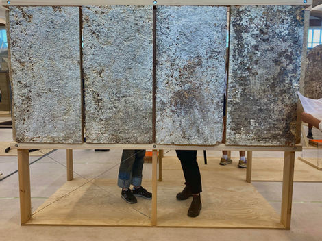 Exhibition of mycelium-grown acoustic panels, spectators' feet