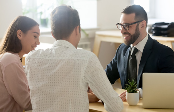 A financial consultant meeting with two clients
