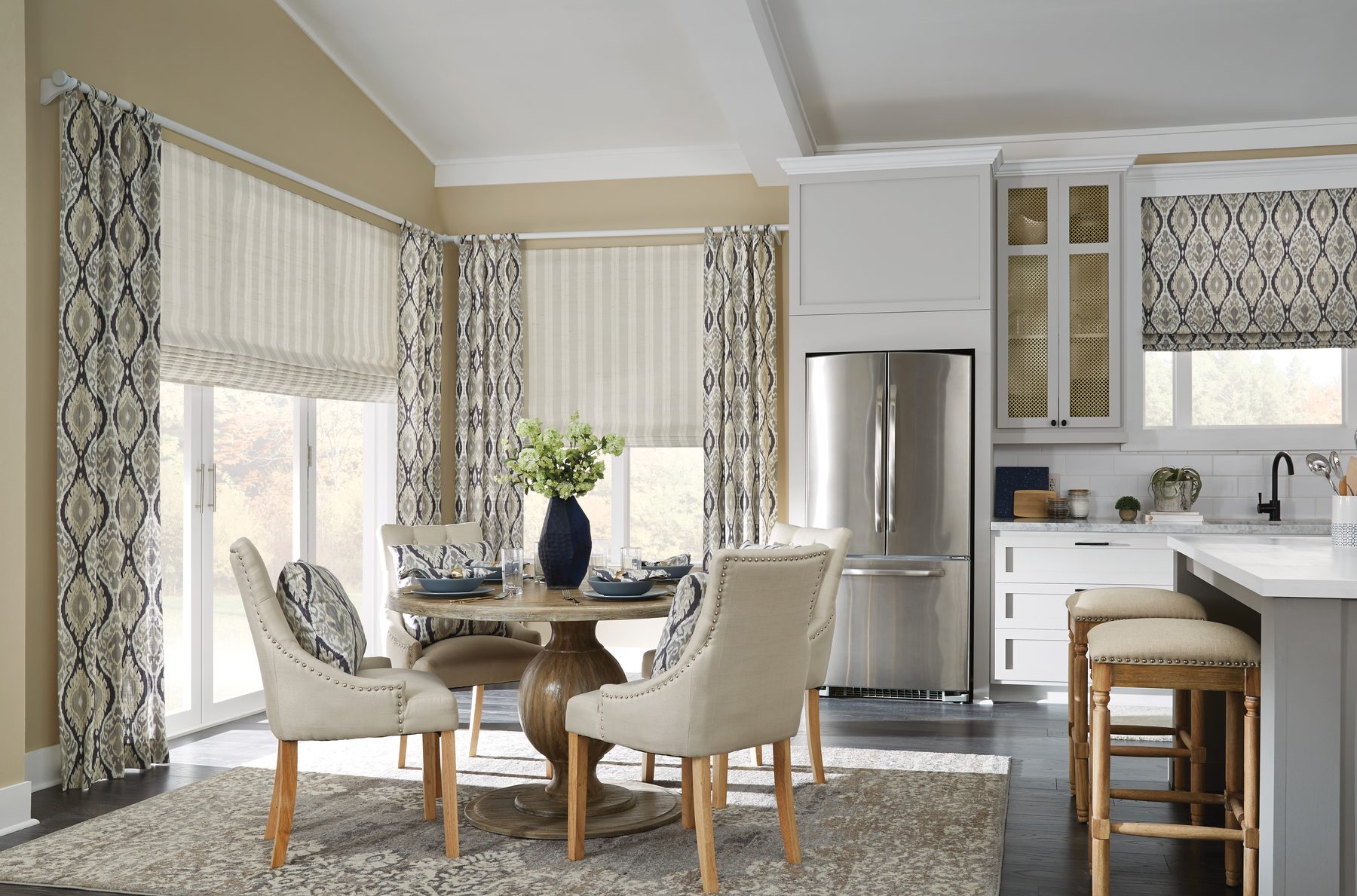 Roman shades and drapery in a dining room