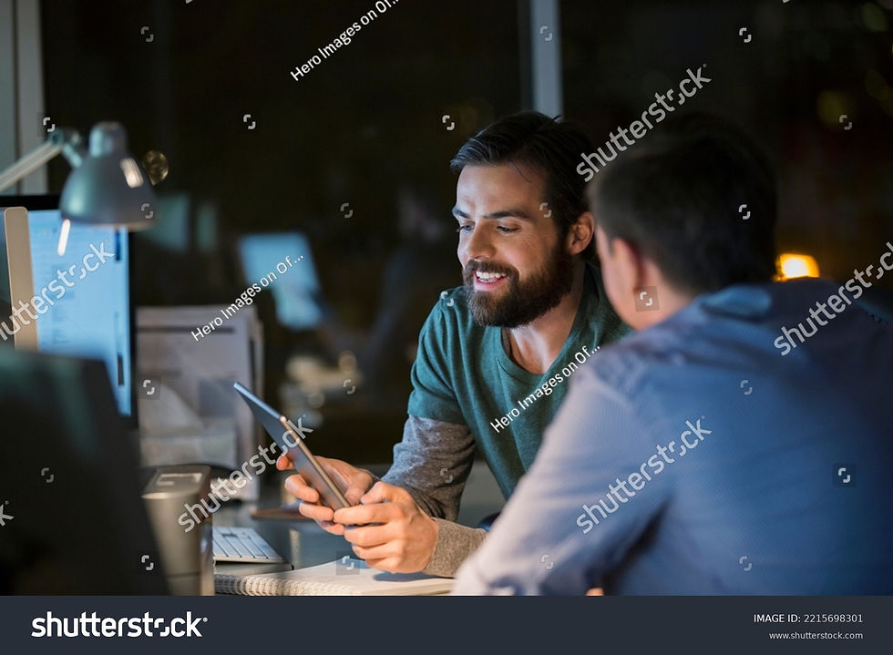 stock-photo-businessmen-with-digital-tablet-working-late-in-office-2215698301 1