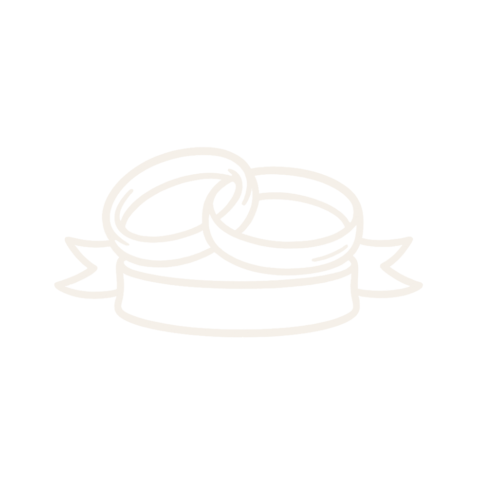Two interlocked rings resting on ribbon.