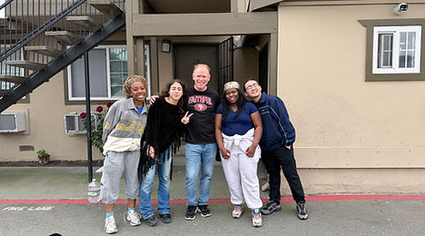 Jim Anderson (center) with Johnny and other students he mentors.