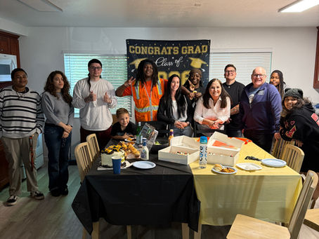 a group of young adults celebrating a graduation at AcademySTAY in Sacramento