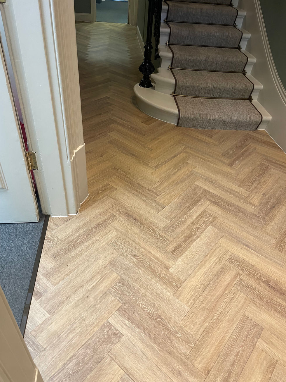 Commercial herringbone Amtico LVT flooring installed over a Jumpax subfloor system in a listed building entrance, Bayswater R