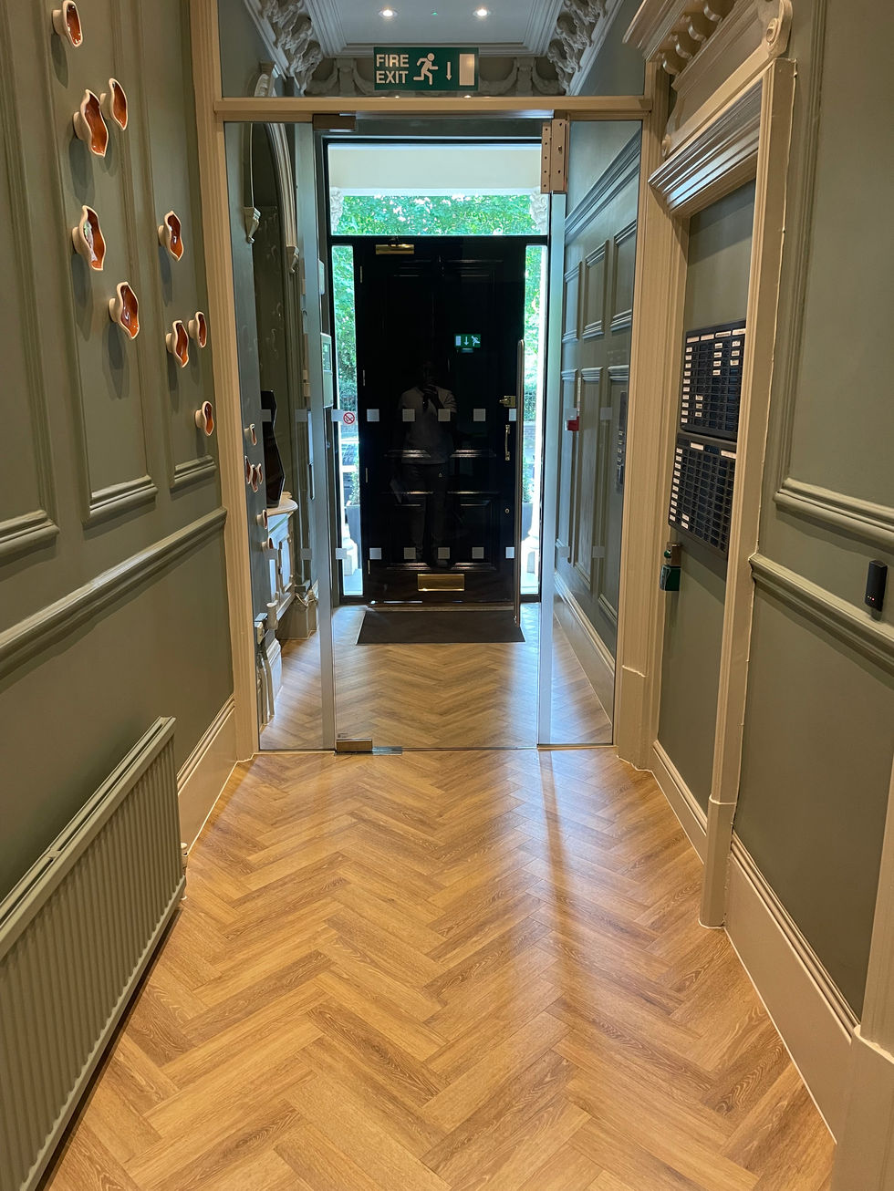 Commercial herringbone Amtico LVT flooring installed over a Jumpax subfloor system in a listed building entrance, Bayswater R