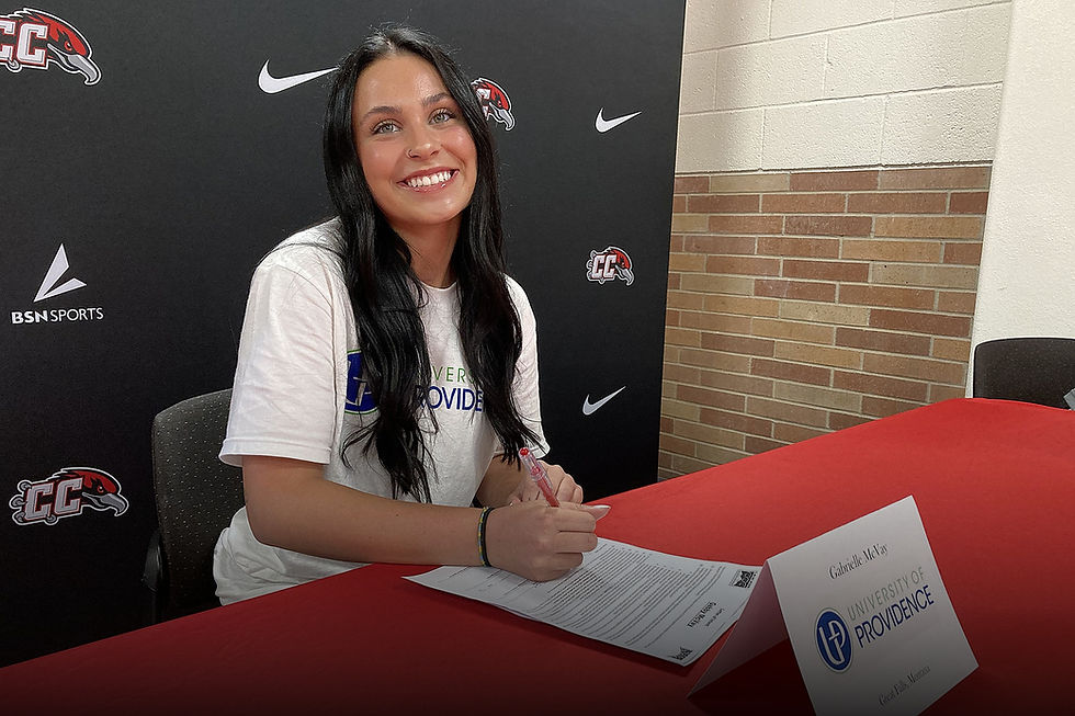 Female soccer player signing her university commitment documents.