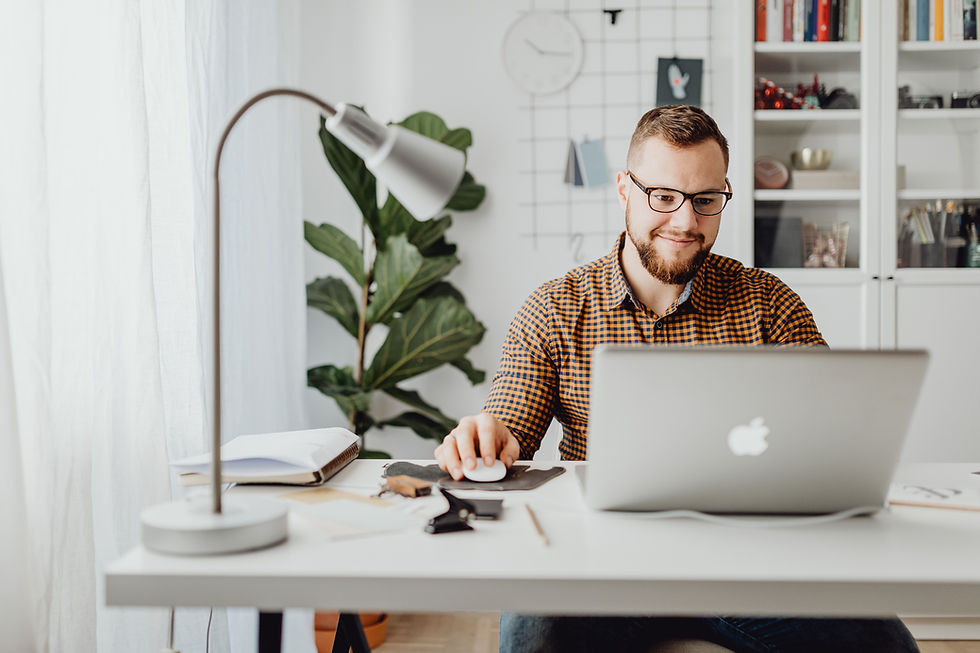Small business owner working at a dedicated home office desk that qualifies for the home office tax deduction