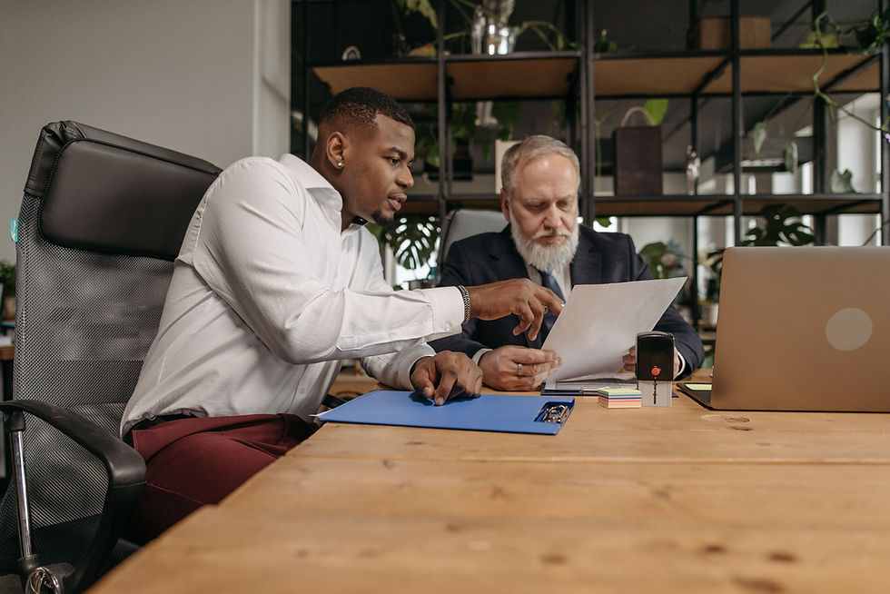 Two business owners reviewing a W-2 vs 1099 worker classification document