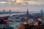 View of Riga old town and Daugava River from St. Peter’s Church observation deck at sunset.