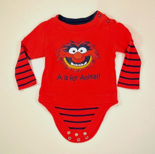 Bodysuit in red and dark blue. Long sleeves .' animal' image on front.