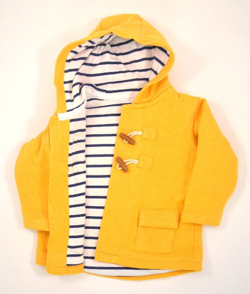 Thumbnail: 2 wood look toggle and loop fixings. Fully lined with blue and white striped material.