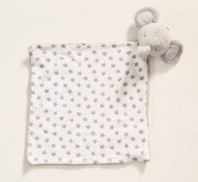 Elephant comforter. 25cm square. White bacground with grey stars design.