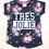 Thumbnail: Top. Dark grey multi. Round neck with pink trim inside back and pink bow.'TRES JOLIE' printed on front in black and white.