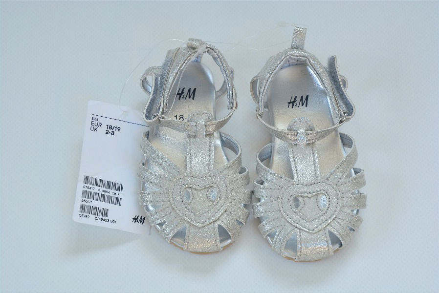 Sandal in silver. Size 2-3uk/18-19eu. T-bar sandal with heart design.