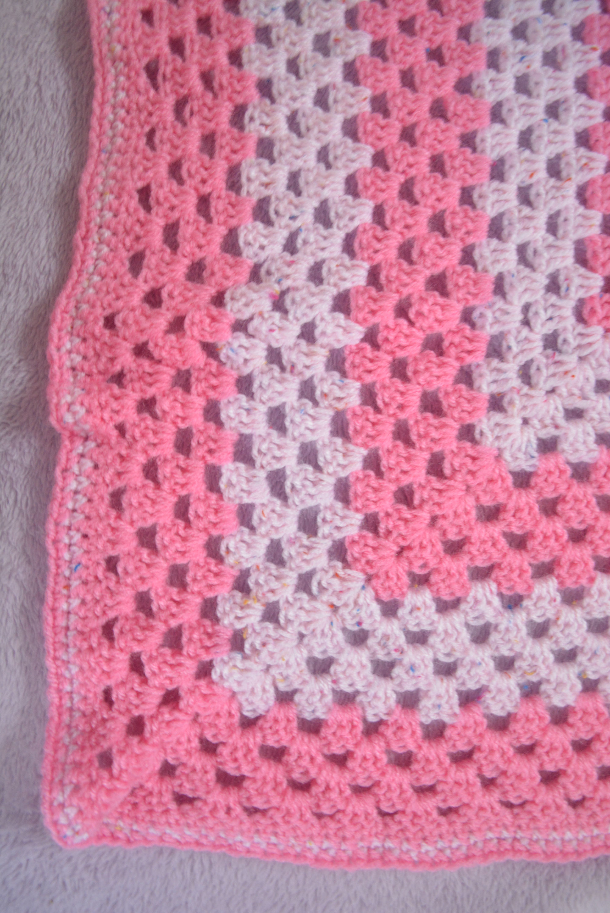 Blanket, pink, 92cm square. Hand crocheted. Design is Granny Stripe stitch.