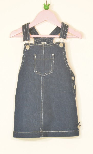 Pinafore skirt.Dark blue.Denim material. Square front neck. Adjustable shoulder straps with classic bib and brace fittings.