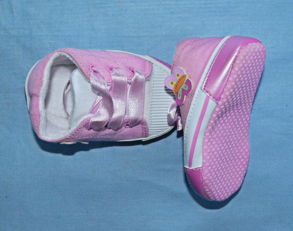 Thumbnail: Shoe upper is pink with pink ribbon laces.
