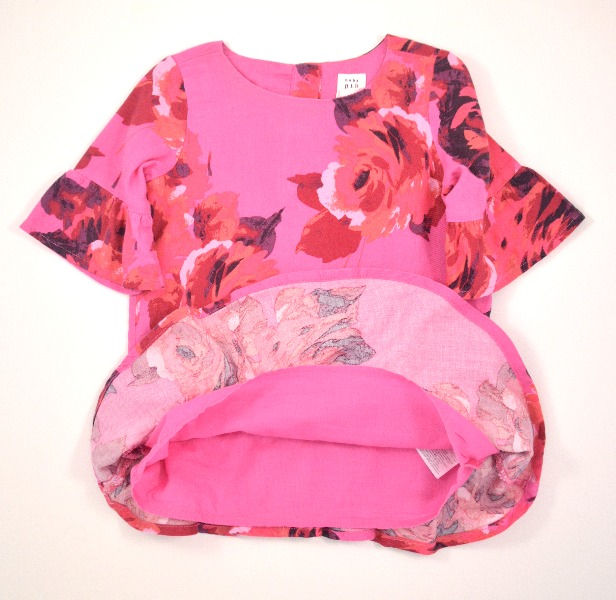 Thumbnail: Round neck with 3 button fastening on back. Body fully lined. Floral material.