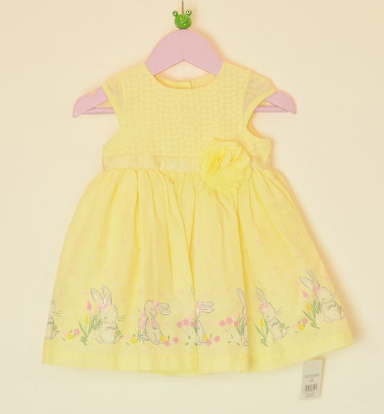 Dress.Yellow.Cap sleeves.Round neck.Small raised spot pattern all over except front bodice which has embroidered flowers.