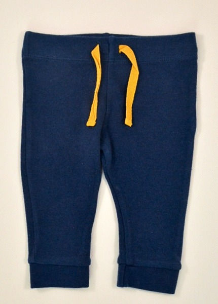 Trousers in Navy blue. Ellasticated waist. Gold pretend tie.