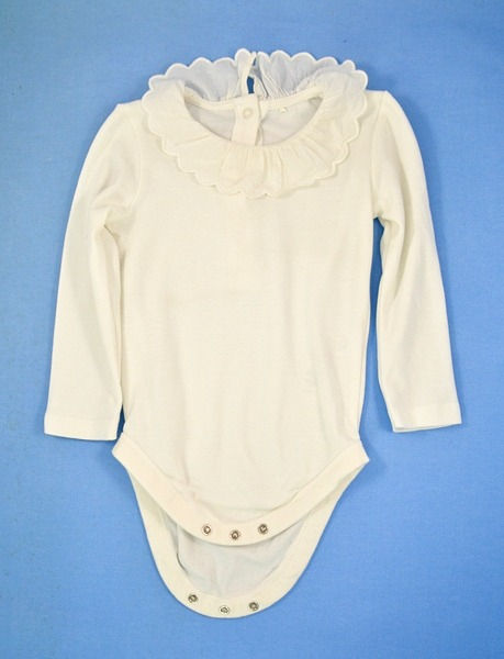 Bodysuit in cream. long sleeves. 3 stud fastening underneath.