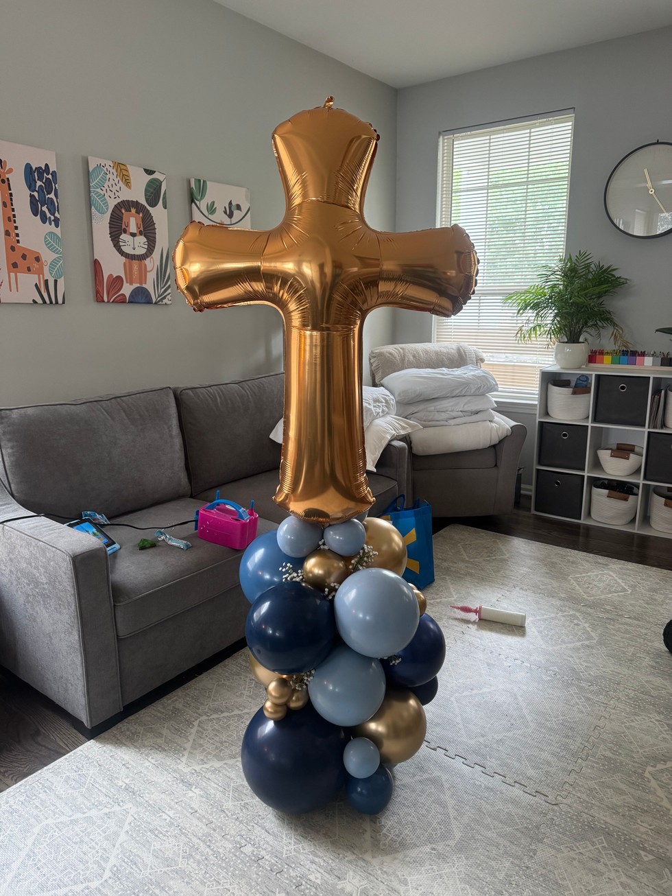 Gold cross balloon centerpiece with blue and gold balloons