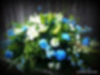 Blue and white casket spray