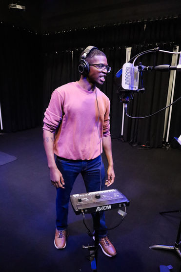 Voice actor recording a cartoon voiceover demo with professional direction