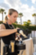 Chef preparing premium caviar service during cocktail hour.